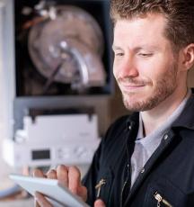 Man servicing boiler