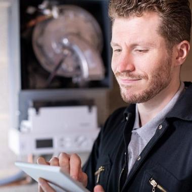 Man servicing boiler