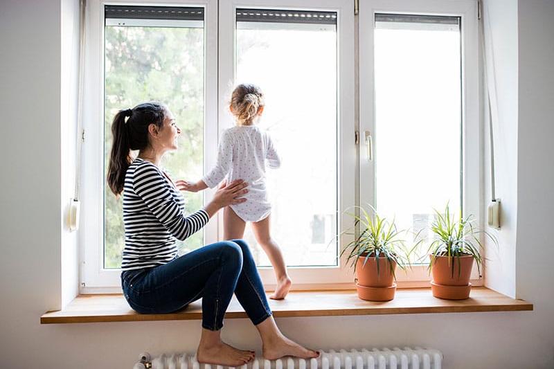 Women with feet on radiator